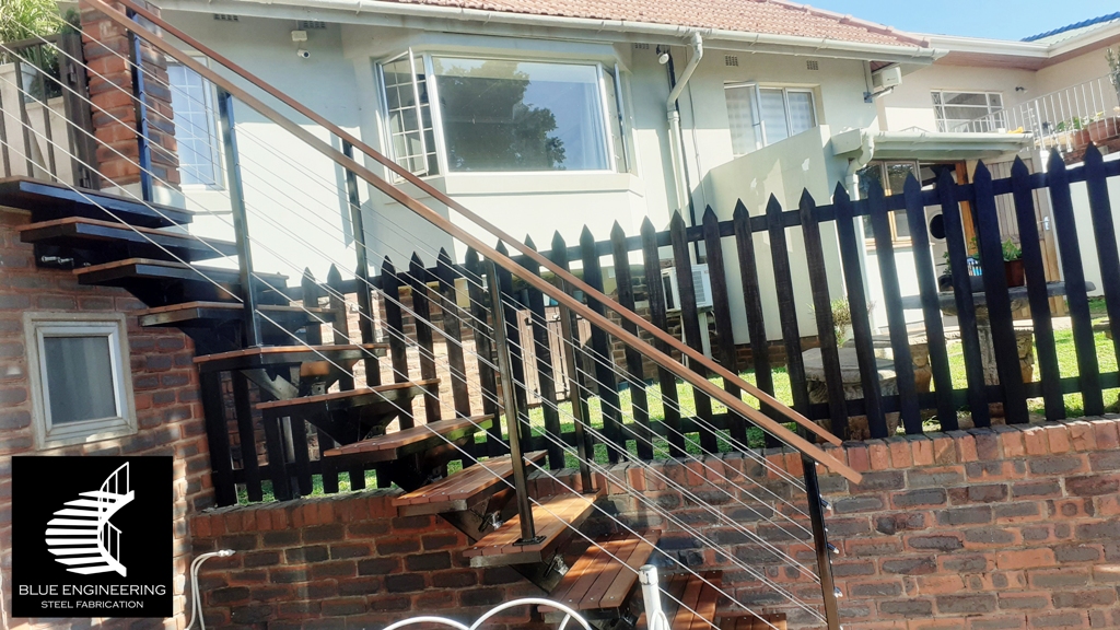 Steel mono stringer staircase with balau clad treads and cable balustrades. Johannesburg, Pretoria, Durban, Gauteng, KwaZulu Natal