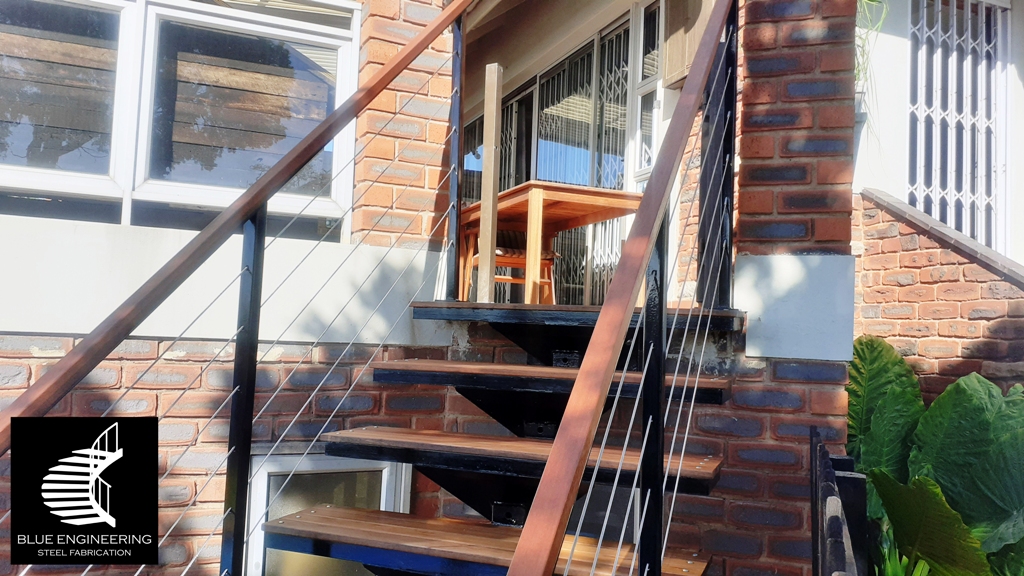 Steel mono stringer staircase with balau clad treads and cable balustrades. Johannesburg, Pretoria, Durban, Gauteng, KwaZulu Natal