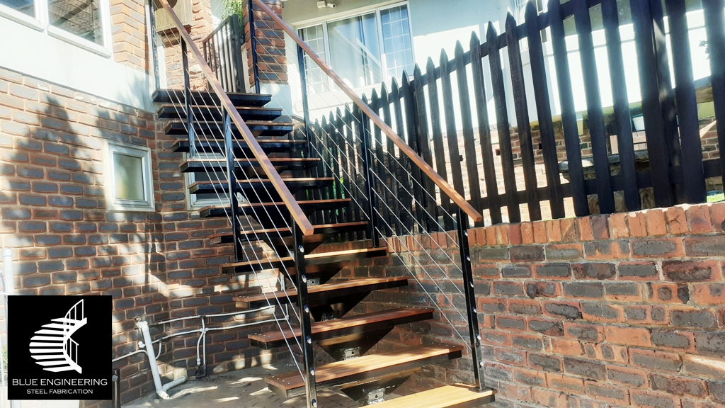 Steel mono stringer staircase with balau clad treads and cable balustrades. Johannesburg, Pretoria, Durban, Gauteng, KwaZulu Natal